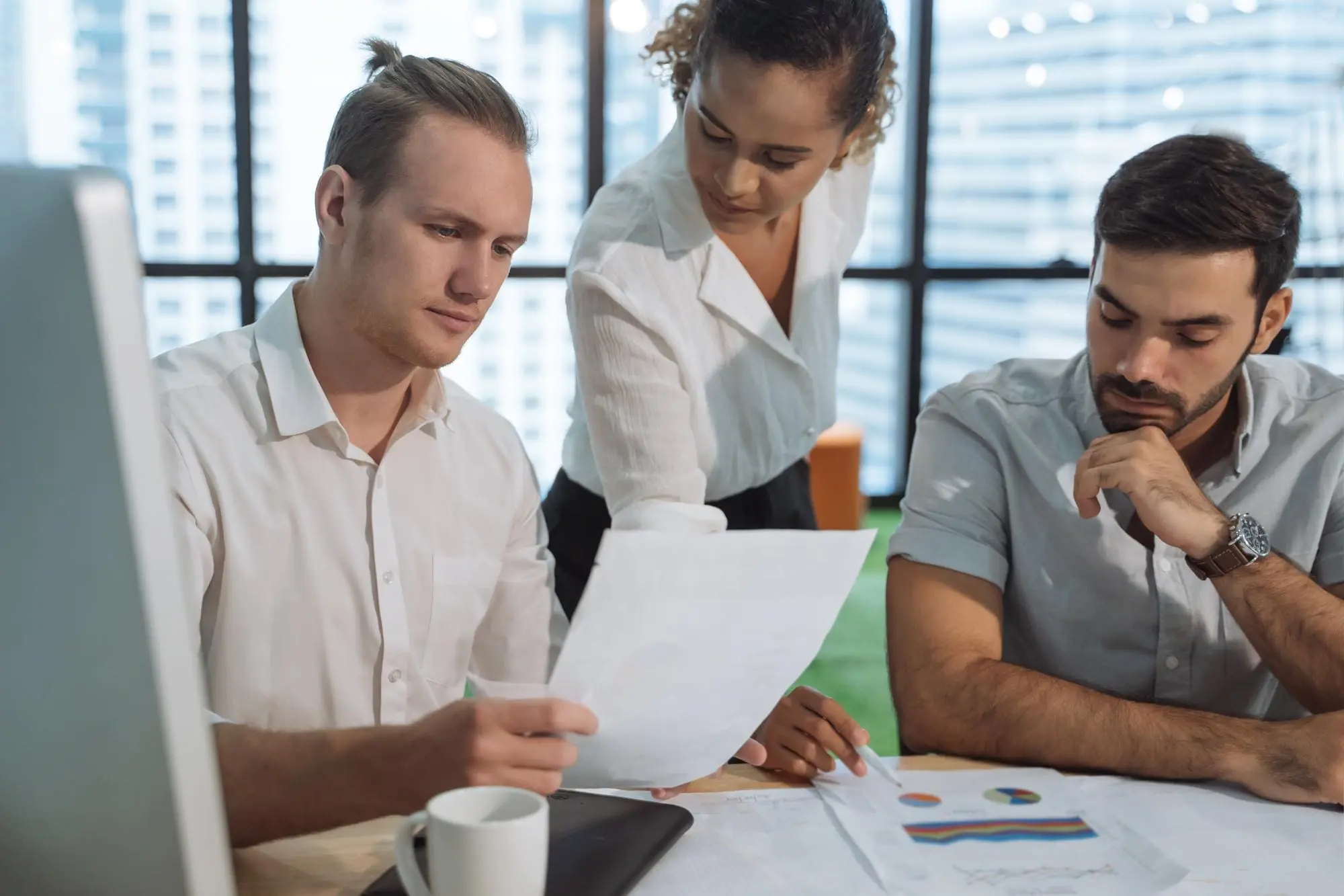 Business people discussing paperwork in office