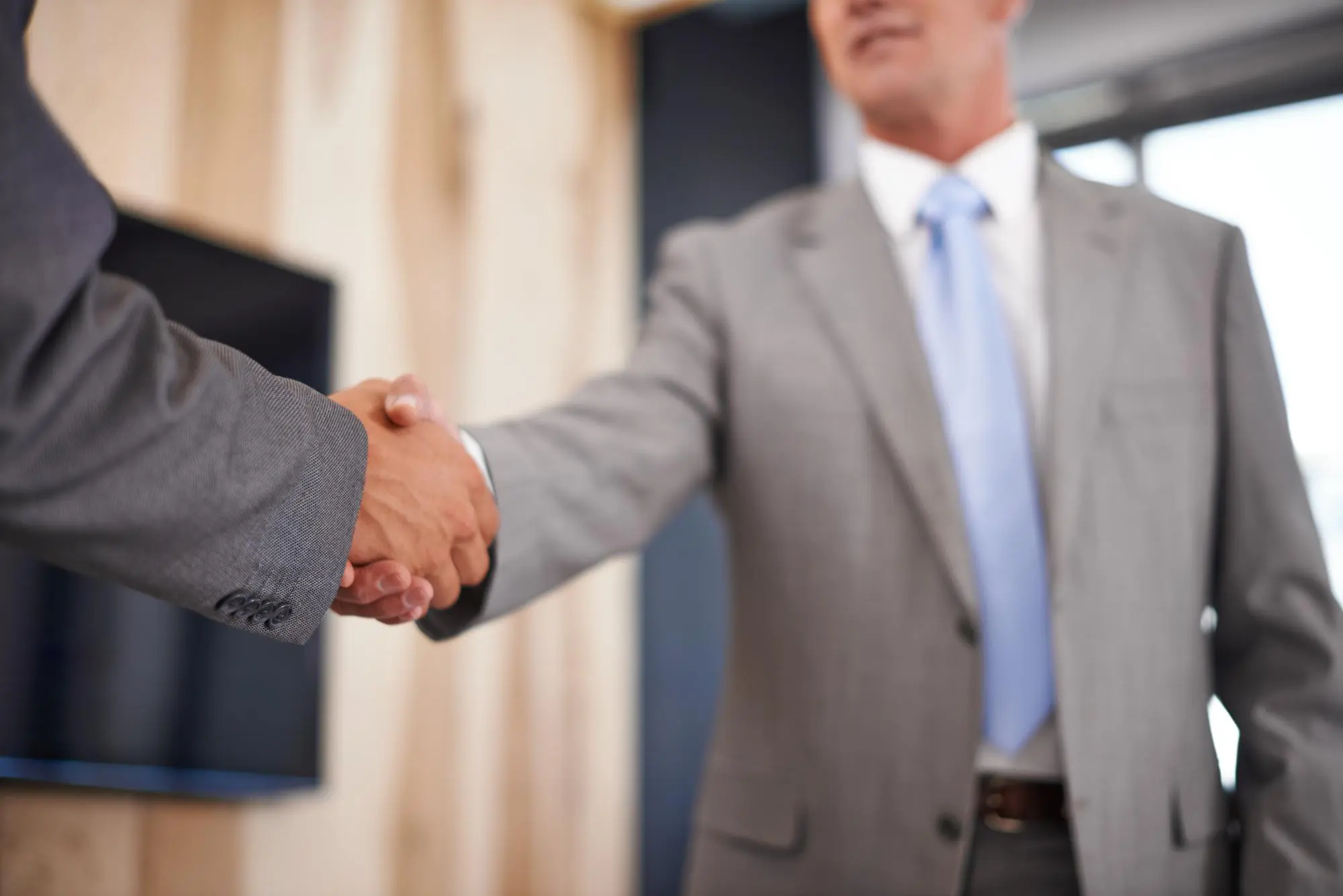 Office meeting and business people with handshake in partnership for deal consultation and negotiation Company director and shaking hands wi