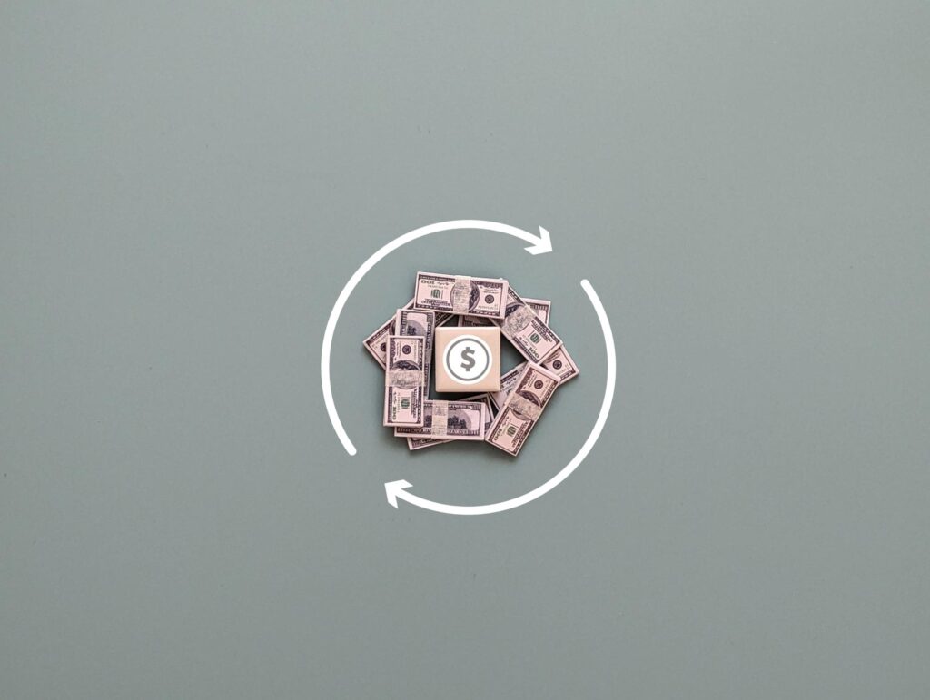 square magnet with currency symbol banknotes and circular arrow concept of cash flow or cash back